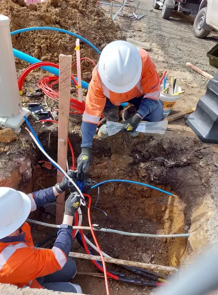 Utility technicians carrying out underground cable work